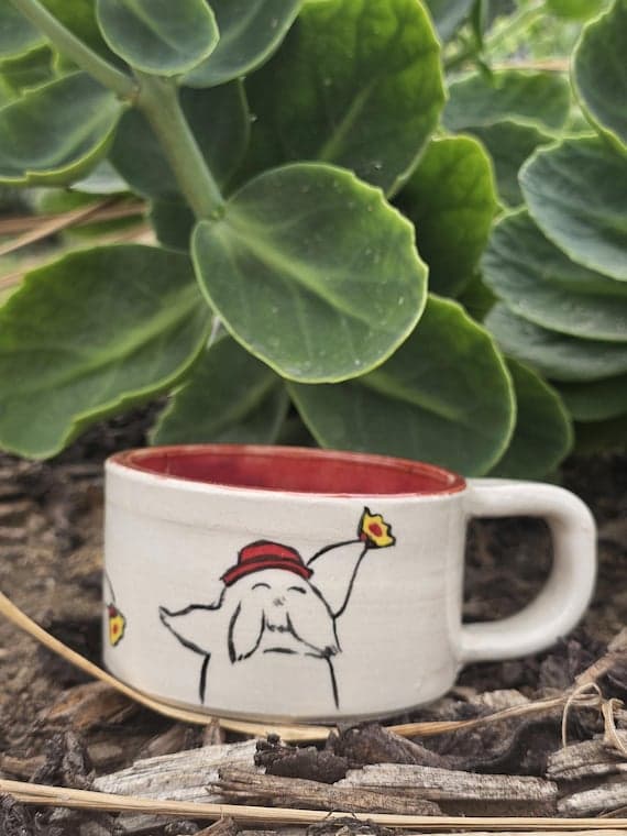 Handmade ceramic mug featuring the Radish Spirit